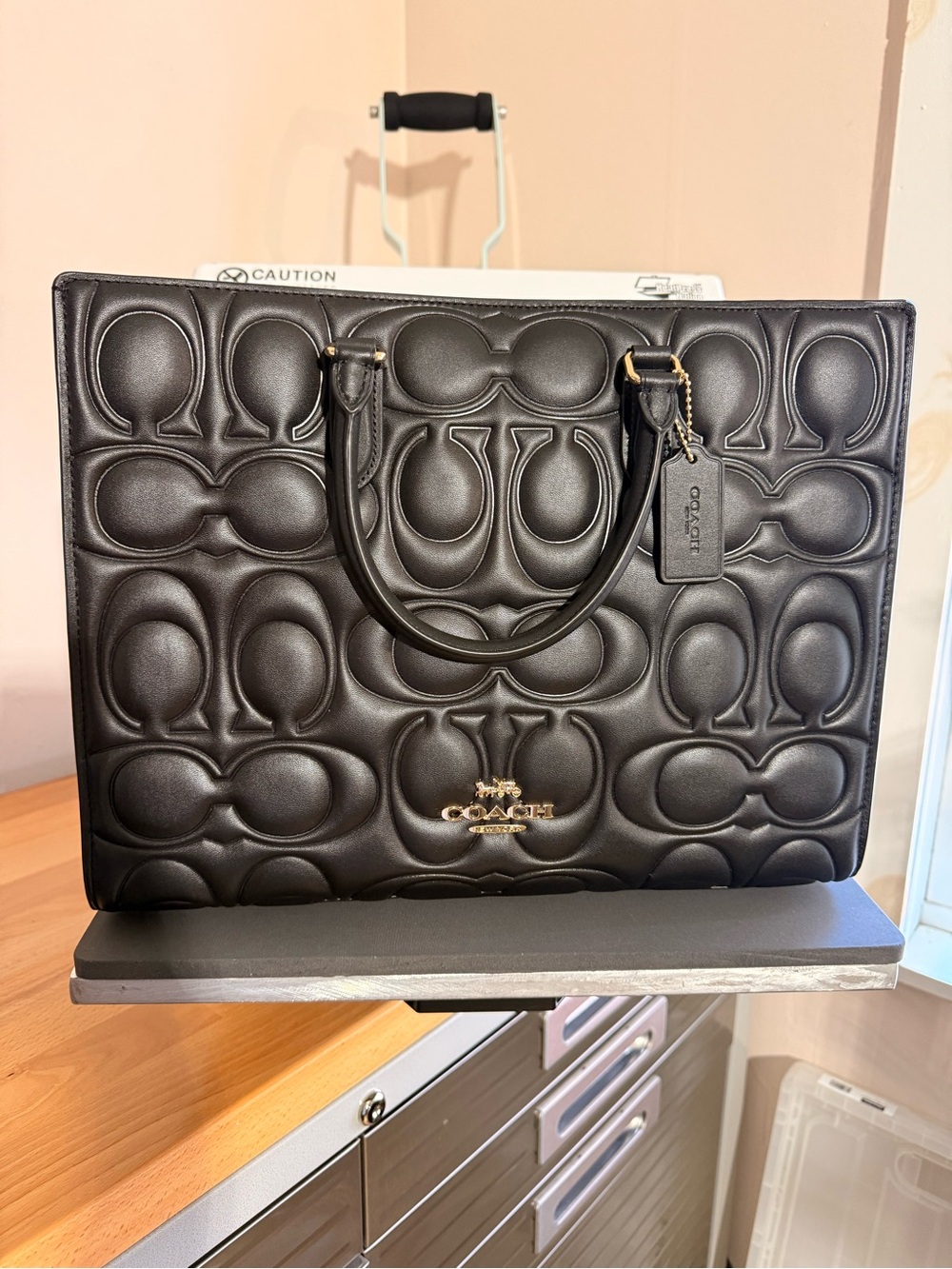 COACH Black Embossed Signature Leather Tote with Gold Hardware